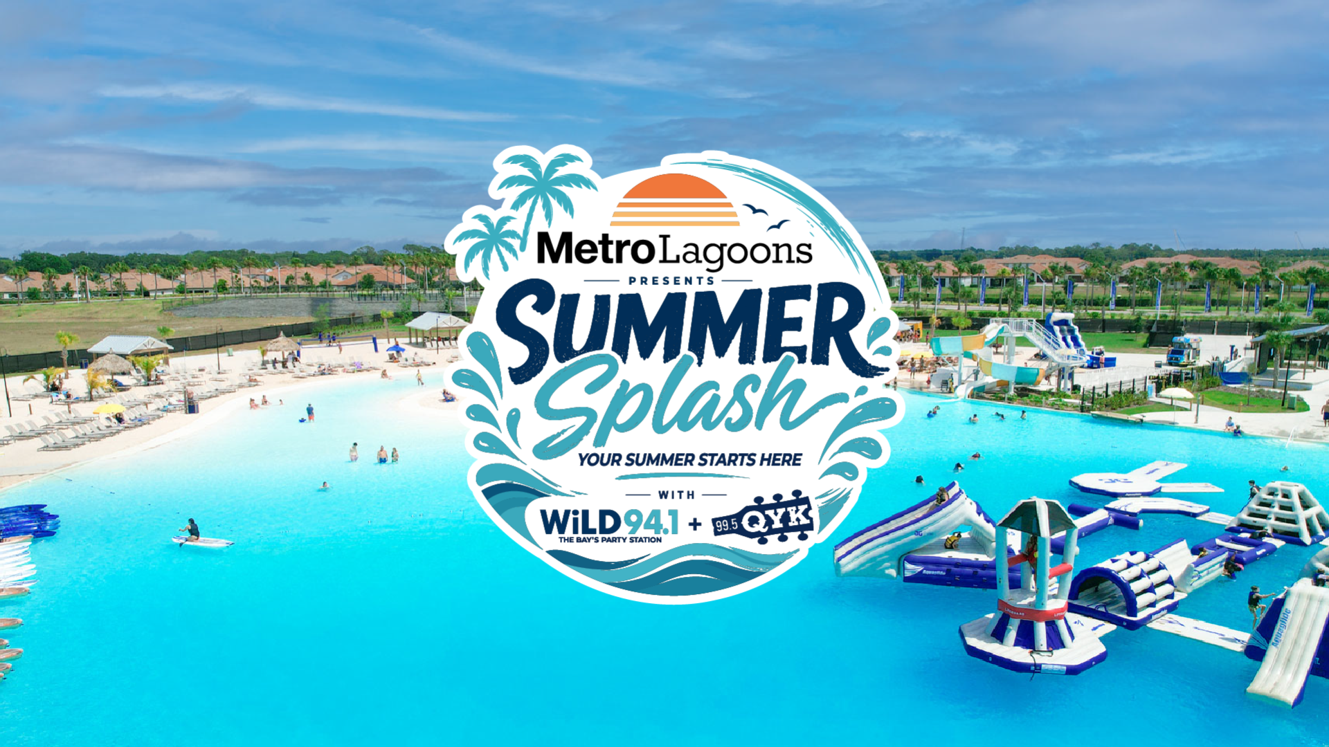 a water park with people swimming and a beach