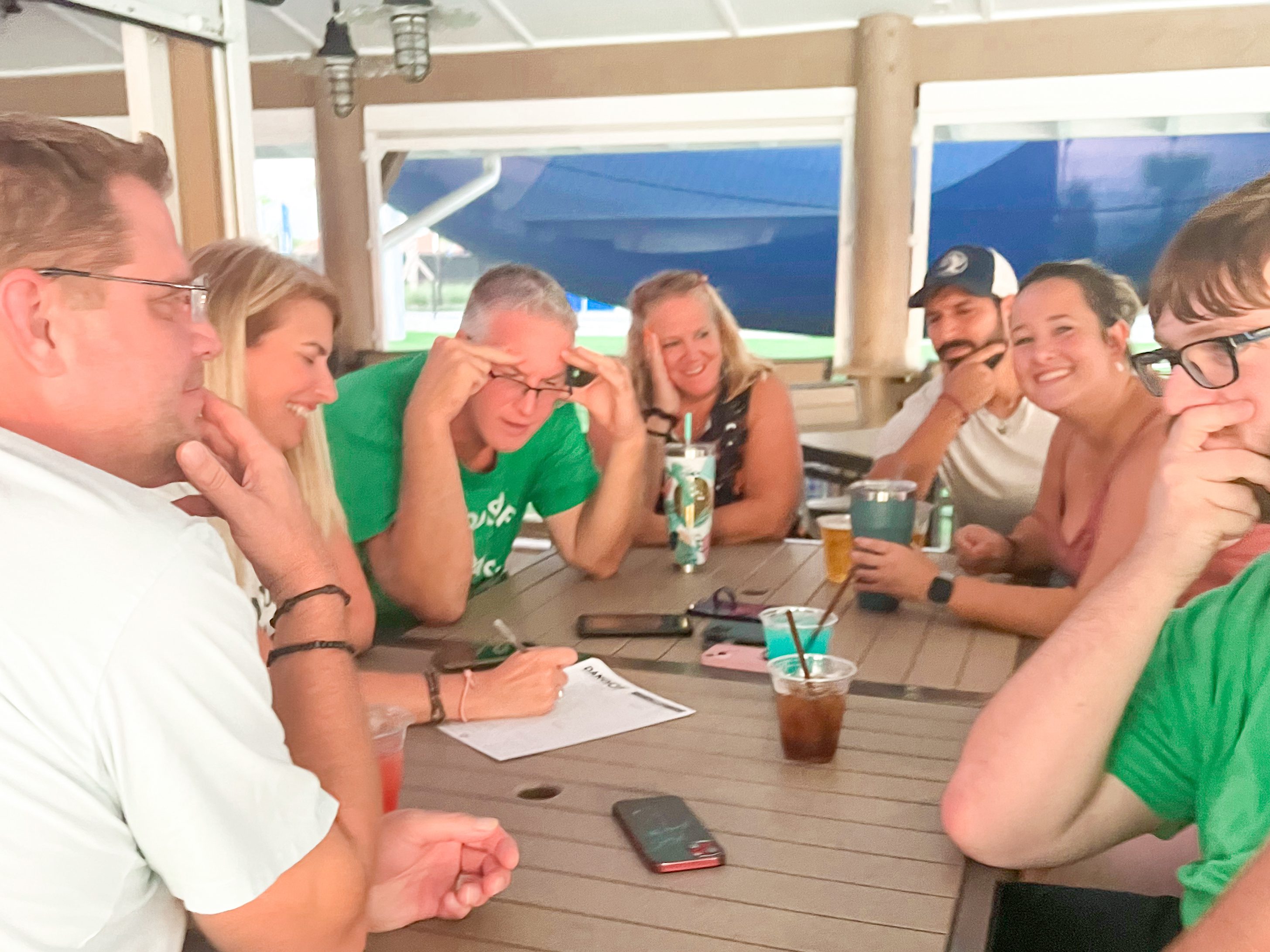 a group of people sitting around a table