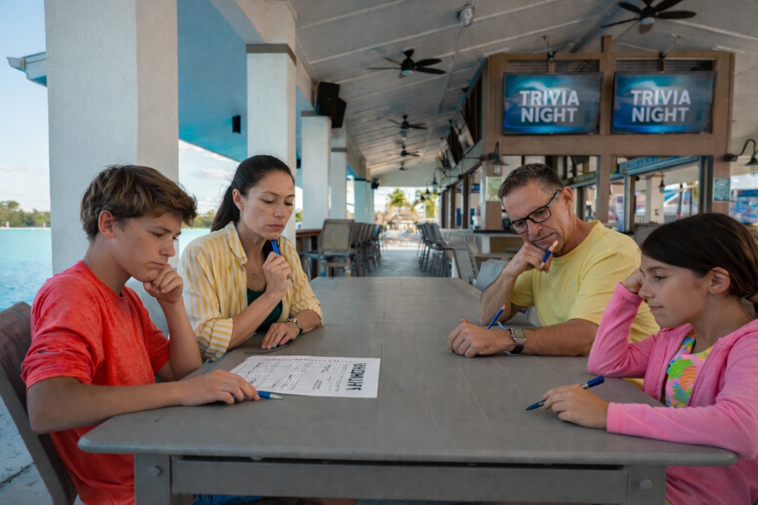 a group of people sitting at a table