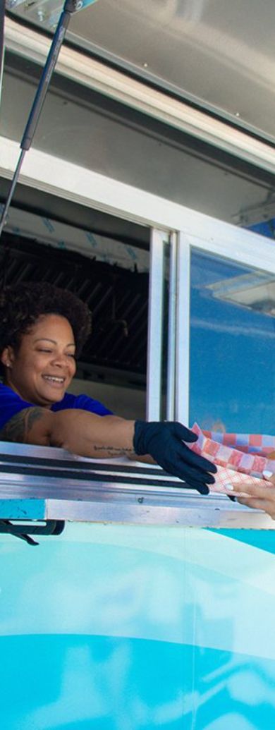 a woman smiling at a customer