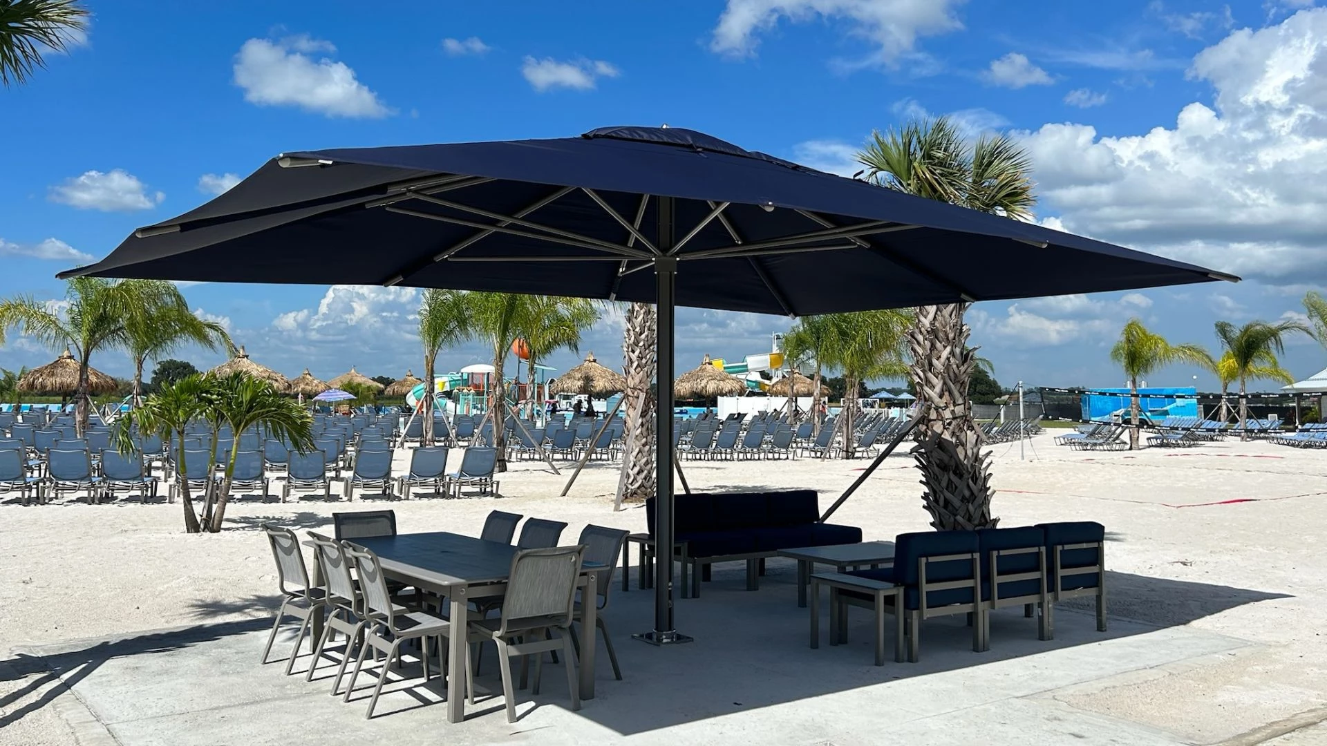 a table and chairs under a umbrella