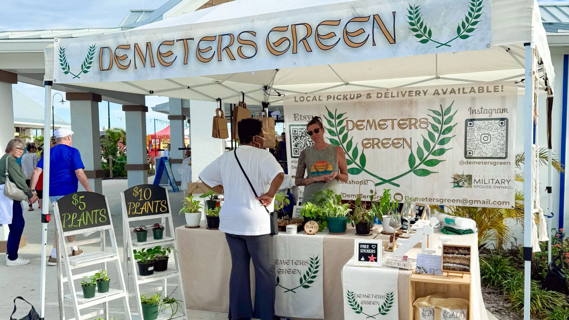 a woman standing next to a woman at a market