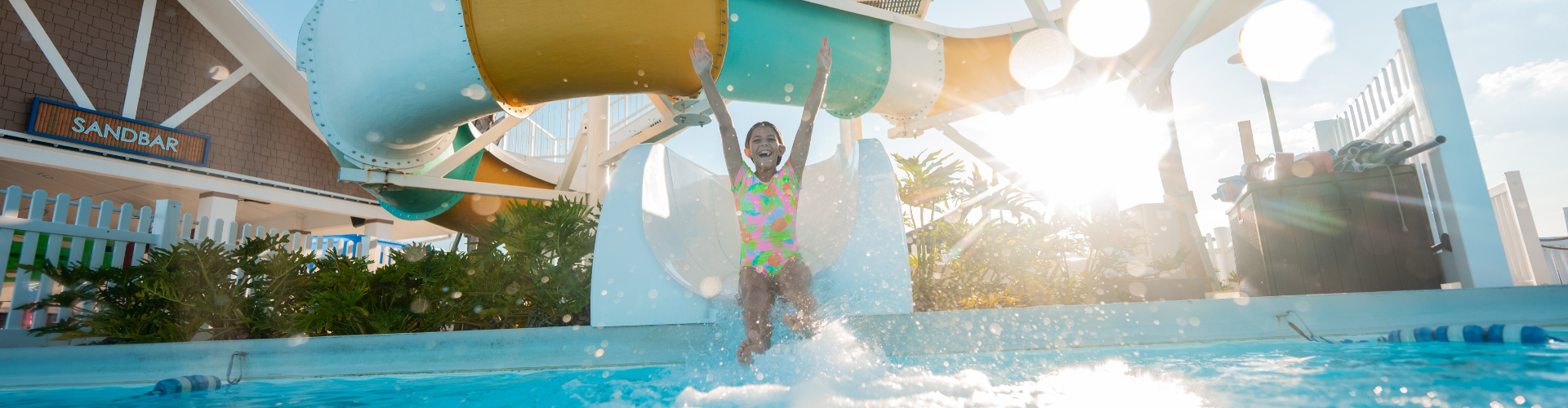 a girl in a swimsuit on a water slide