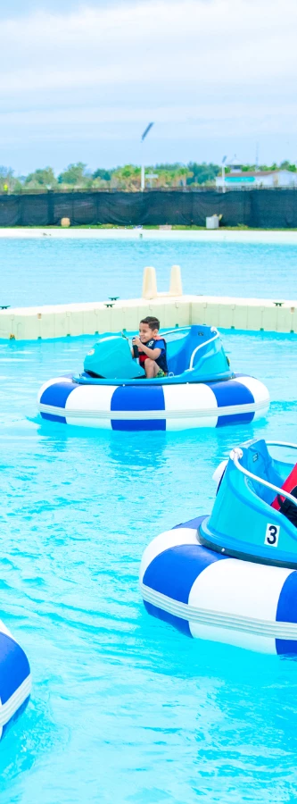a boy on a boat in a pool