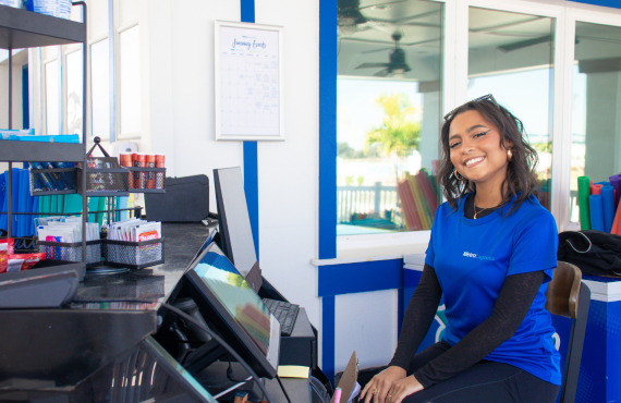 a woman sitting at a cashier