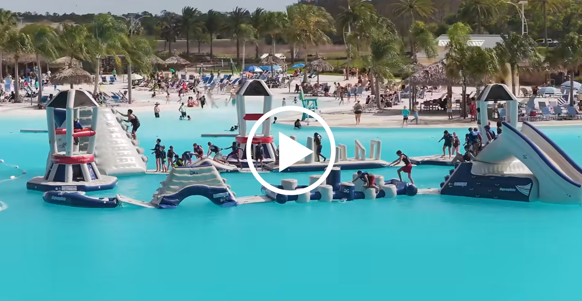a water park with people and a play button