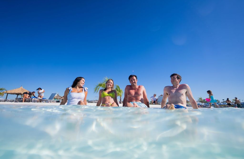 a group of people sitting in water
