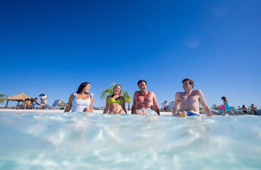 a group of people sitting in water