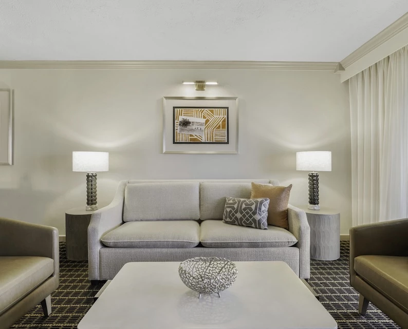 a living room with a couch and chairs