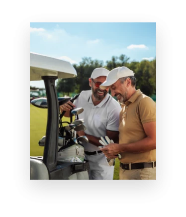 a group of men standing next to golf clubs