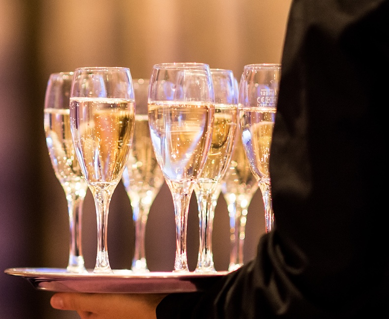 a tray of champagne glasses