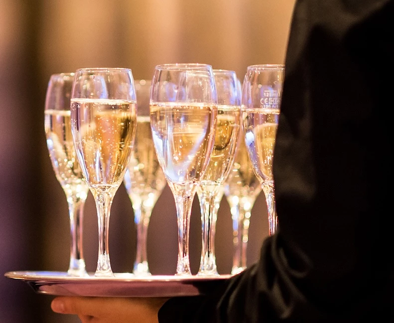 a tray of champagne glasses