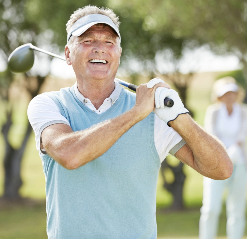 a man holding a golf club