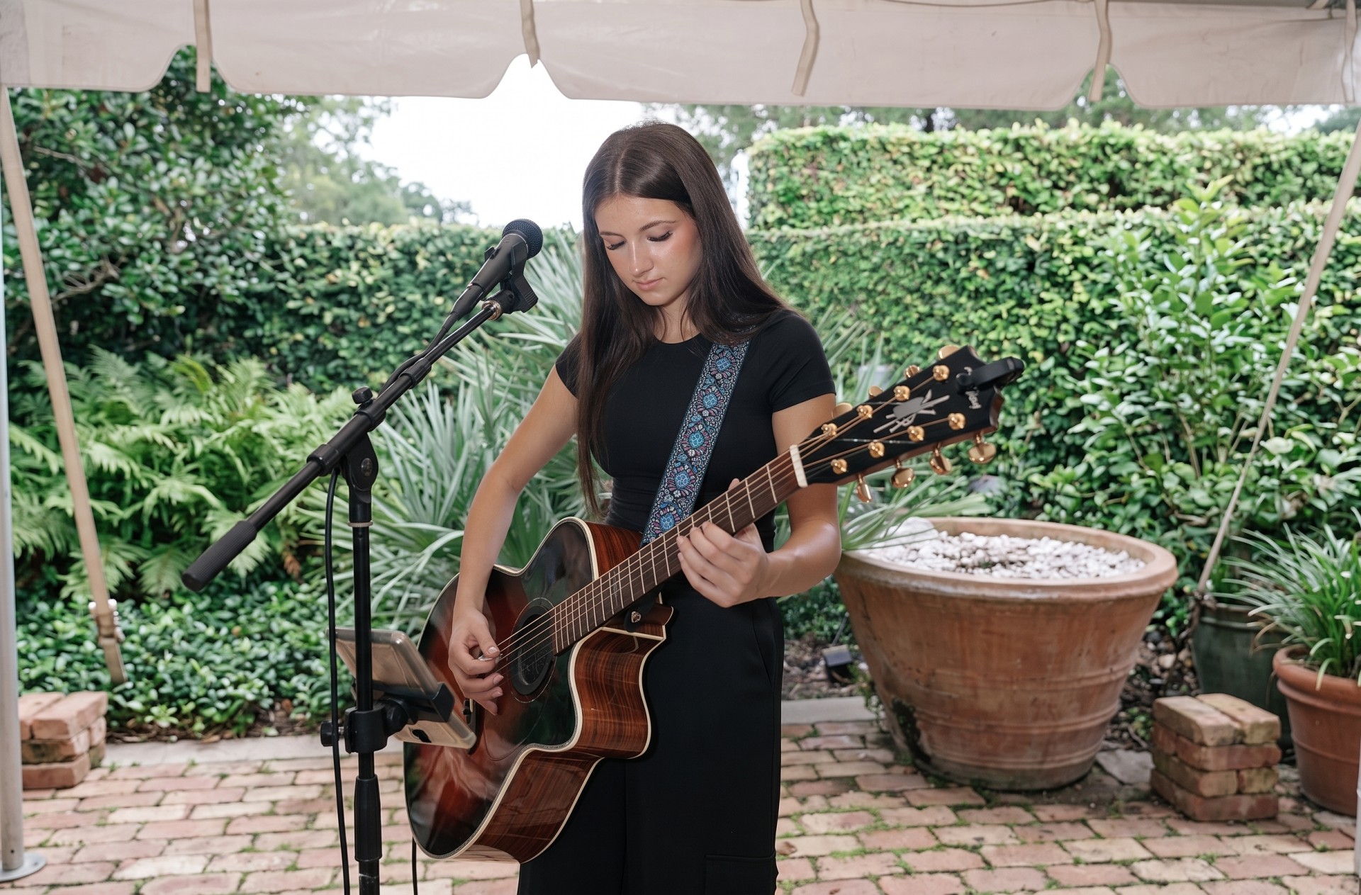 a woman playing a guitar