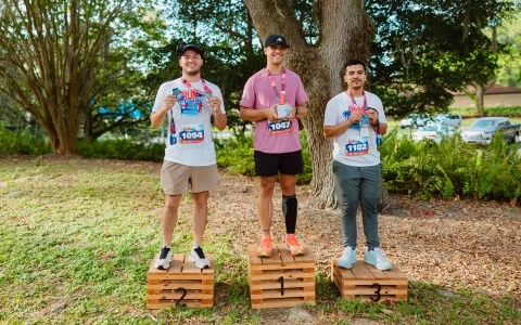 a group of men standing on wooden boxes with numbers on their shoulders