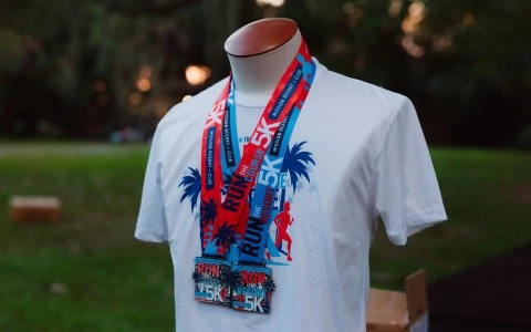 a mannequin wearing a white shirt with a red and blue lanyard
