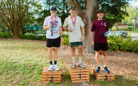 a group of men standing on wooden boxes