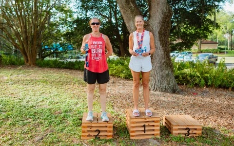 two women standing on wooden boxes