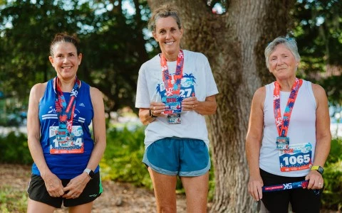 a group of women wearing matching shirts and lanyards