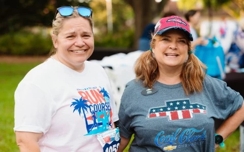 two women smiling at the camera