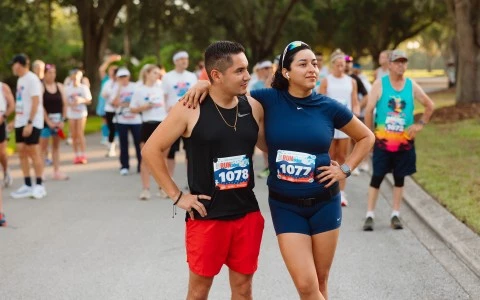 a man and woman with numbers on their shirts