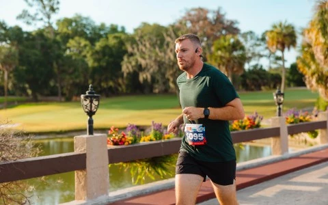 a man running on a bridge