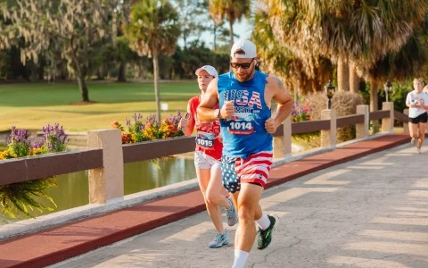 a man and woman running on a sidewalk