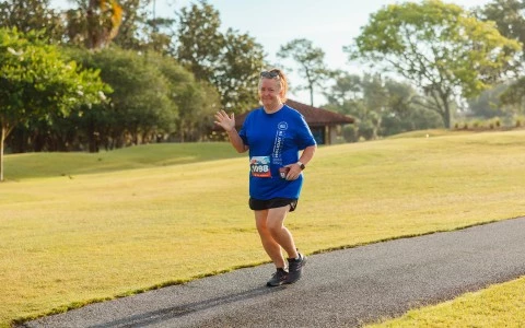 a woman running on a path