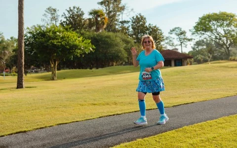 a woman running on a path