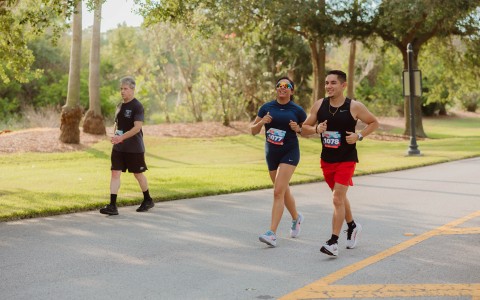a group of people running on a road