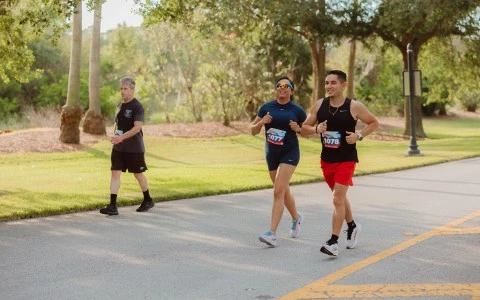 a group of people running on a road