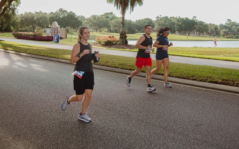 a group of people running on a road