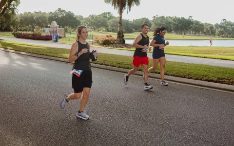 a group of people running on a road