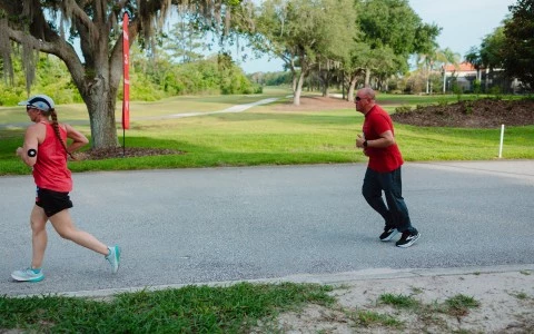 a man and a child running on a road