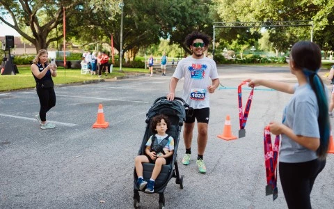 a man pushing a stroller with a child in a stroller