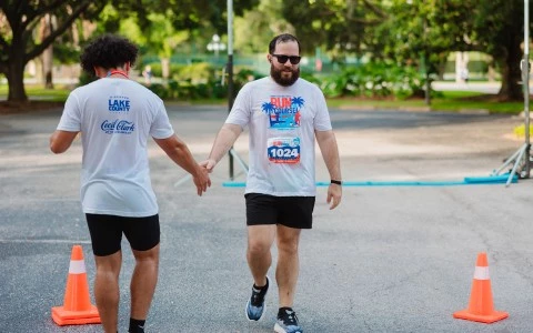 a man holding hands and walking with another man