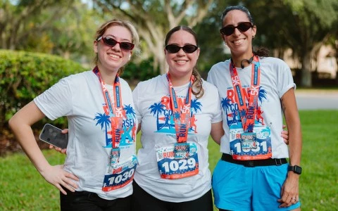 a group of women wearing matching shirts and lanyards