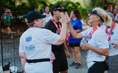 a group of people giving each other a high five