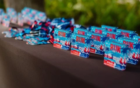 a group of small blue and red tags on a table