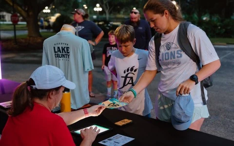 a woman giving a card to a woman