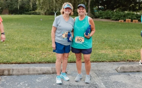two women wearing matching running outfits