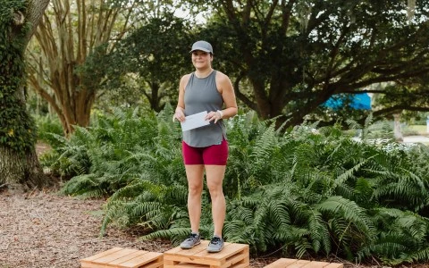 a woman standing on a wooden platform