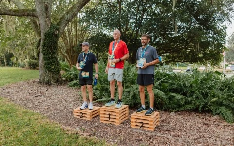 a group of men standing on wooden crates