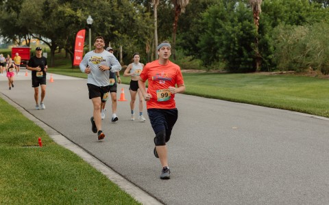 a group of people running on a road