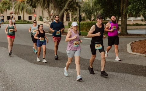 a group of people running on a road