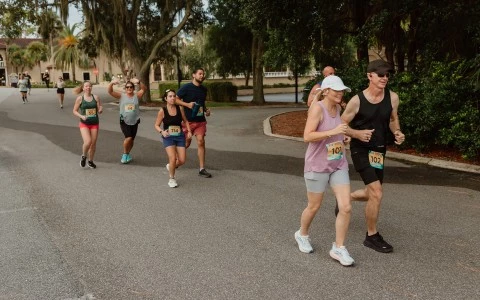 a group of people running on a road