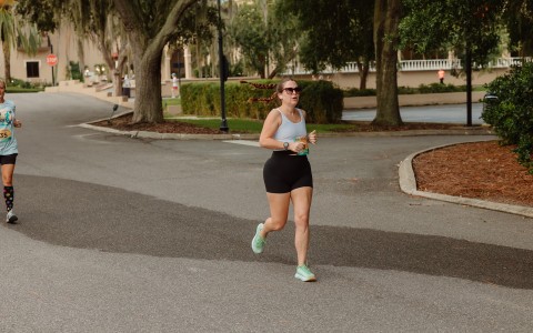 a woman running on a road