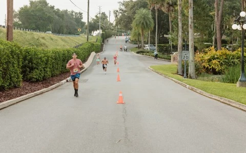 a group of people running on a road