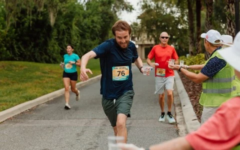a group of people running on a road