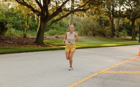 a woman running on a road